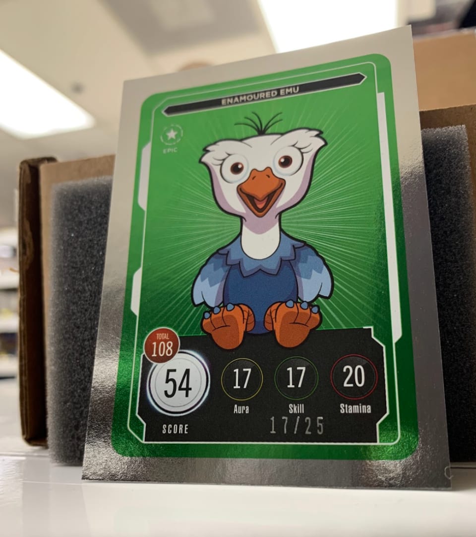 All cards have a total score, as seen in the white bubble. Depending on the card's rarity, there is a boost added! The "Epic" foil insert has a 2x boost and is numbered on the bottom right!