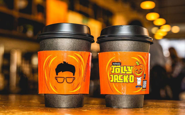 The Jolly Jack-O coffee sleeve hits different