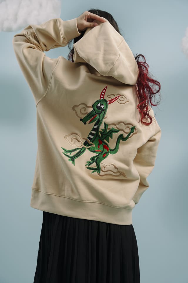A fully embroidered Driven Dragon on the back of the hoodie