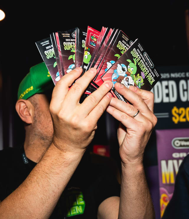 GaryVee with a handful of Super Sticker packs at The National 2025.